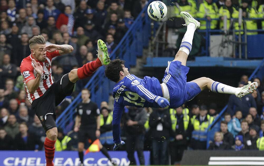 Chelsea's Diego Costa competes for the ball with Southampton's Toby Alderweireld, during the English Premier League soccer match between Chelsea and Southampton at Stamford Bridge stadium in London. 