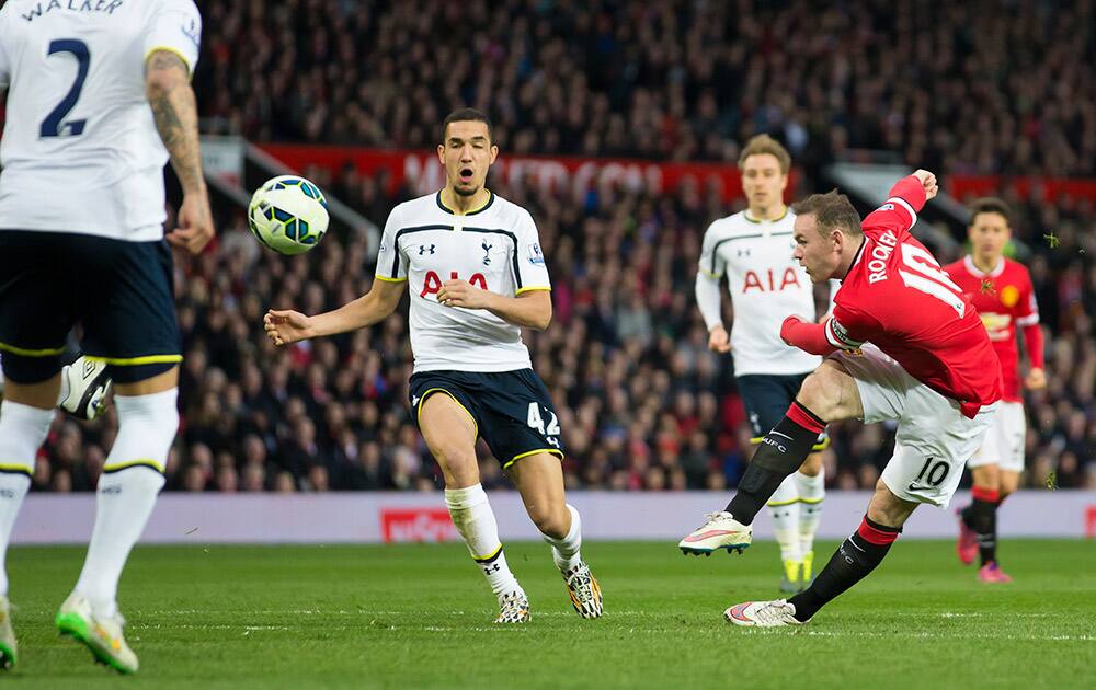 Manchester United's Wayne Rooney takes a shot at goal during the English Premier League soccer match between Manchester United and Tottenham Hotspur at Old Trafford Stadium, Manchester, England.