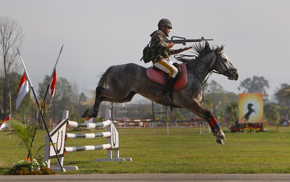 A Nepalese Army soldier demonstrates his horse riding skills during the Ghode Jatra festival, an annual horse race festival, in Kathmandu, Nepal.