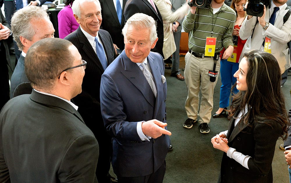 Britain's Prince Charles speaks with presenters at a display of technology at the Kentucky Center for African American Heritage in Louisville, Ky.