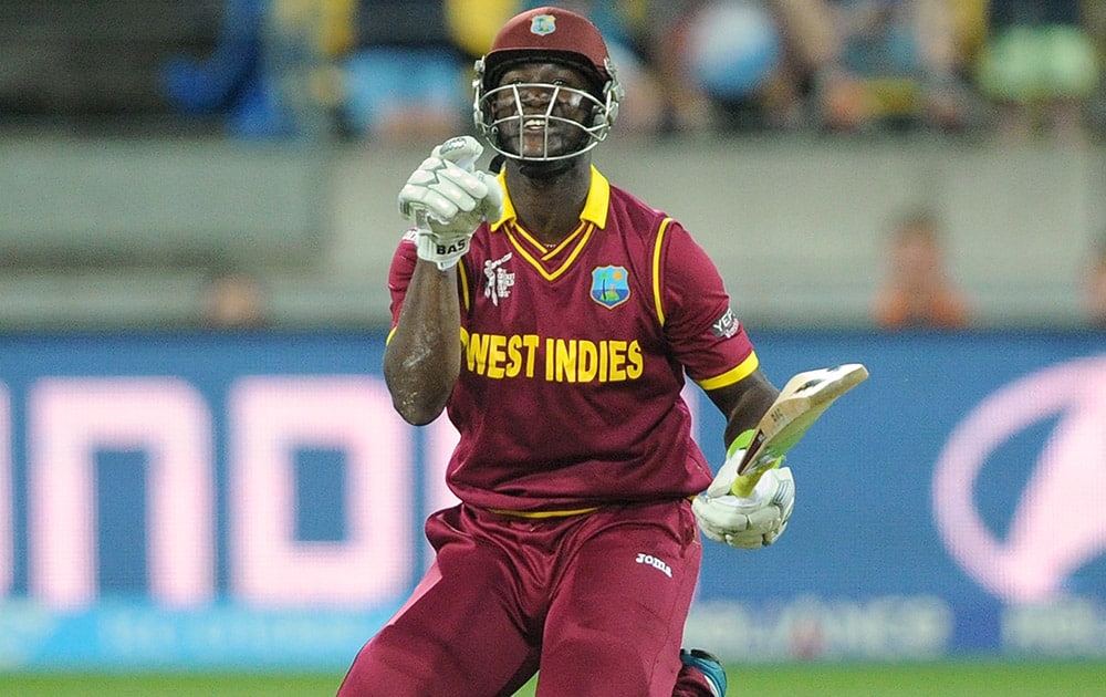 West Indies batsman Darren Sammy gestures after falling over while batting against New Zealand during their Cricket World Cup quarterfinal match in Wellington.