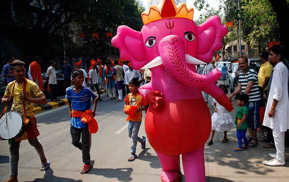 People participate in a procession celebrating 'Gudi Padwa' or the Marathi New Year in in Mumbai.