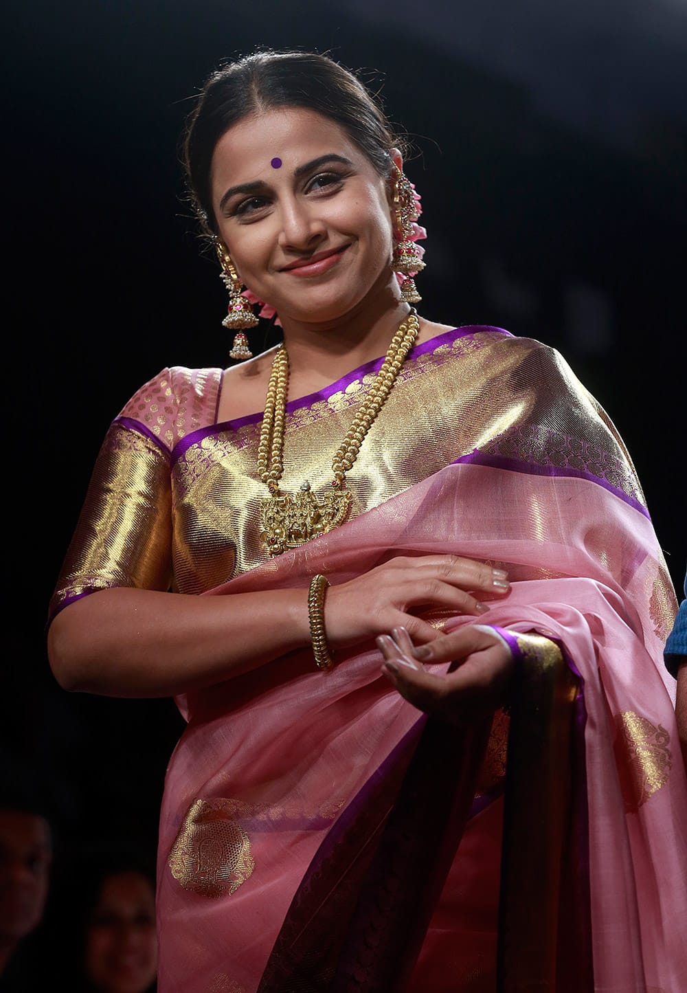 Vidya Balan displays a creation by Gaurang during the Lakme Fashion Week Summer Resort 2015 in Mumbai.