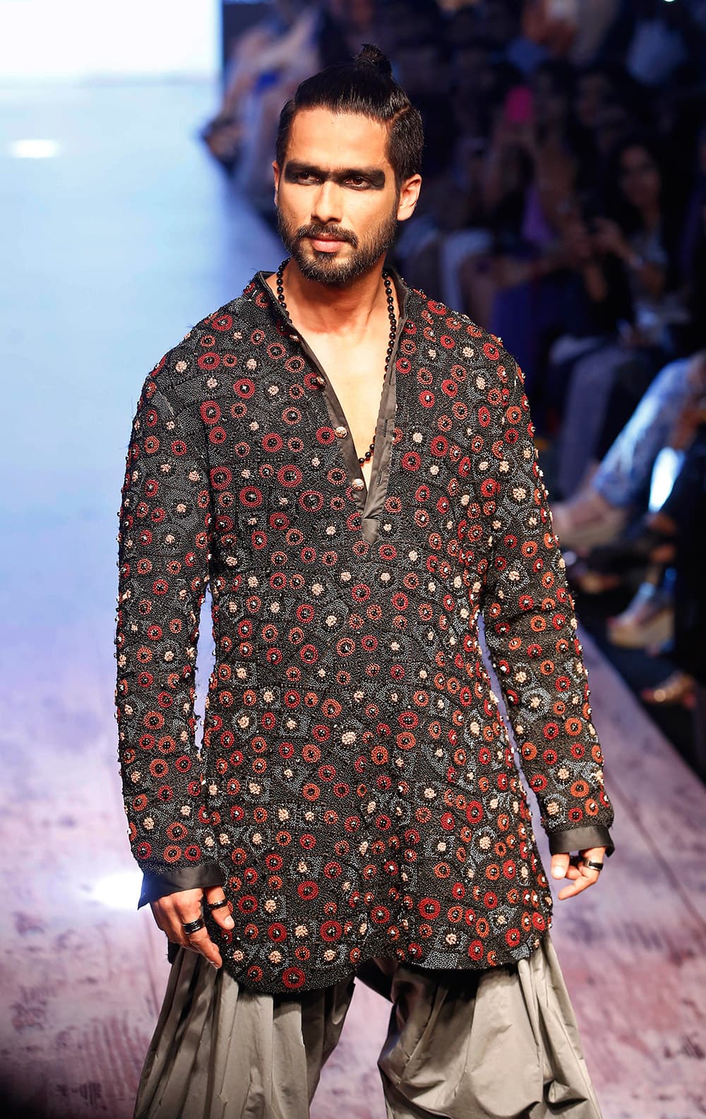 Shahid Kapoor walks the ramp showcasing a Kunal Rawal creation during the Lakme Fashion Week Summer Resort 2015 in Mumbai.