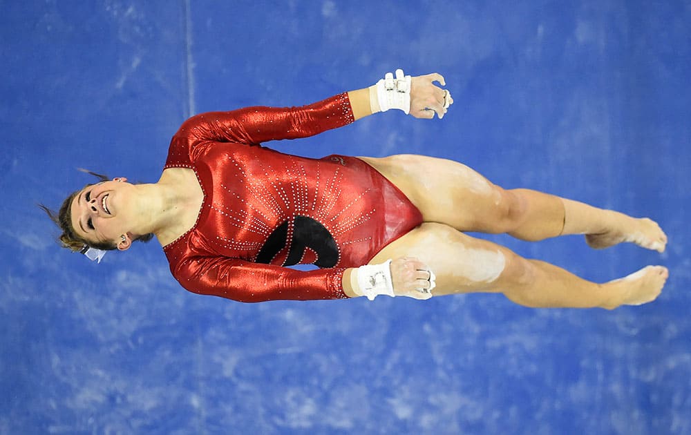 Georgia's Brandie Jay performs on the uneven bars during the NCAA college SEC gymnastics championship, in Duluth, Ga. 