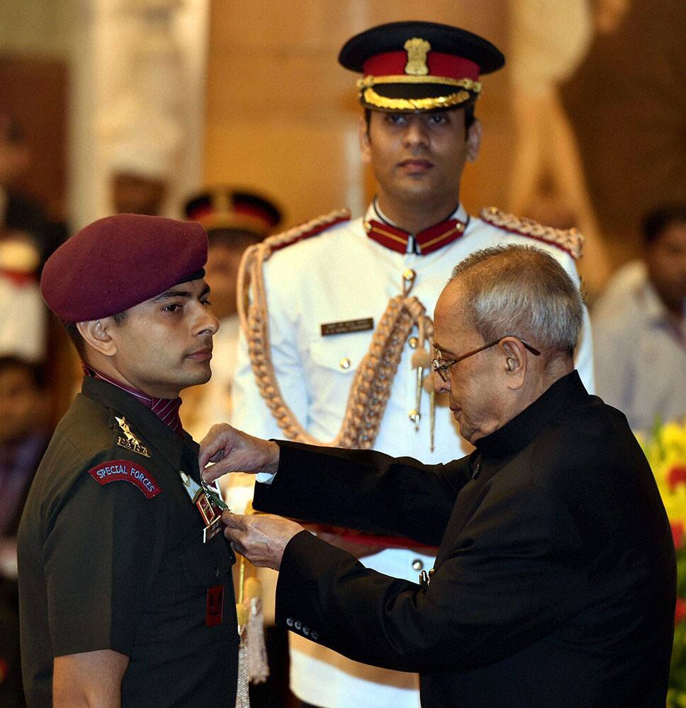 President Pranab Mukherjee presenting Kirti Chakra to Captain Jaidev at the Defence Investiture Ceremony 2015 at Rashtrapati Bhavan.