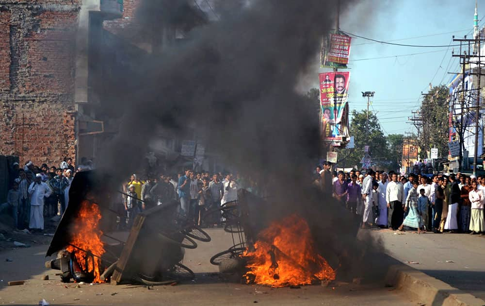 Vehicles and carts set on fire by angry people after death of a Muslim student in Varanasi.