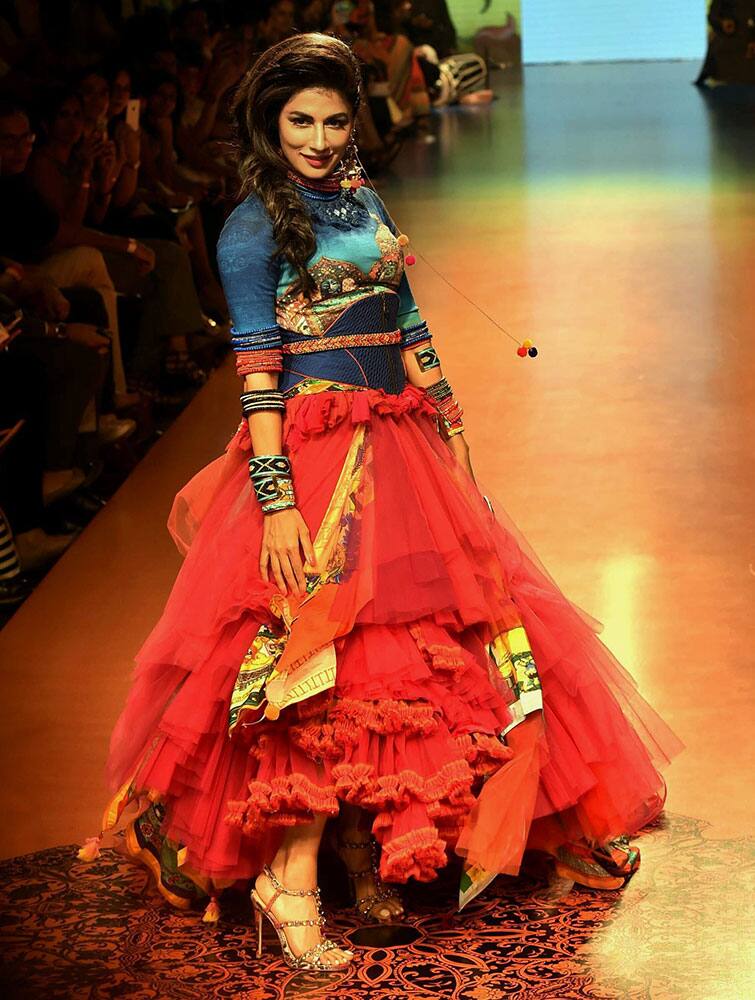 Bollywood actress Chitrangada Singh walks the ramp in designer Tarun Tahilianis creation during the Lakme Fashion Week Summer Resort-2015, in Mumbai.