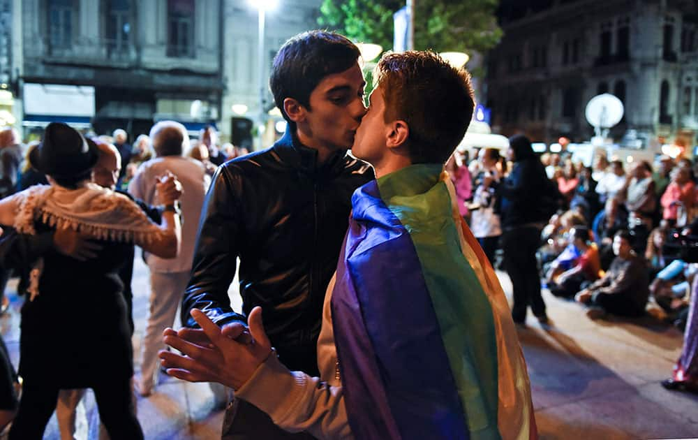 A couple kiss as they tango in a downtown square in Montevideo, Uruguay.  Human rights groups coordinated the dance to protest what happened at an event in the same square last week, when two women dancing were told to leave because lesbians and gays were not welcomed. 