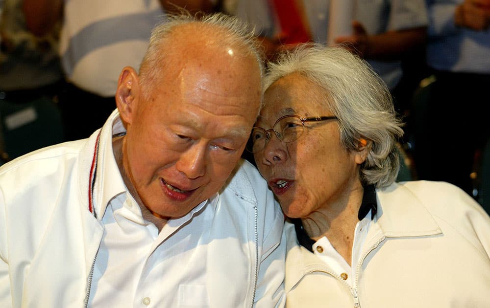 FILE - In this May 1, 2006, file photo, Singapore's then Minister Mentor Lee Kuan Yew, left, shares a light moment with his wife, Kwa Geok Choo, right, during the Labour Day Rally in Singapore. Lee Kuan Yew, the founder of modern Singapore who helped transform the sleepy port into one of the world's richest nations, died Monday, March 23, 2015, the government said. He was 91. 