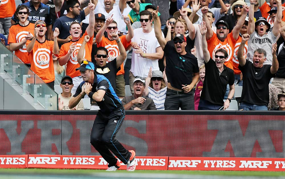 New Zealand’s Tim Southee take s catch to dismiss South African batsman Quinton De Kock during their Cricket World Cup semifinal in Auckland, New Zealand.