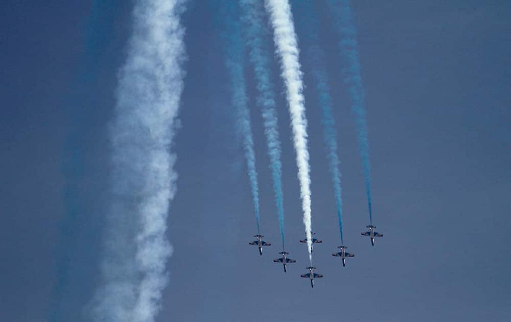 Pakistan Air Force fighter jets demonstrate an aerobatic performance during the Pakistan National Day parade in Islamabad, Pakistan.