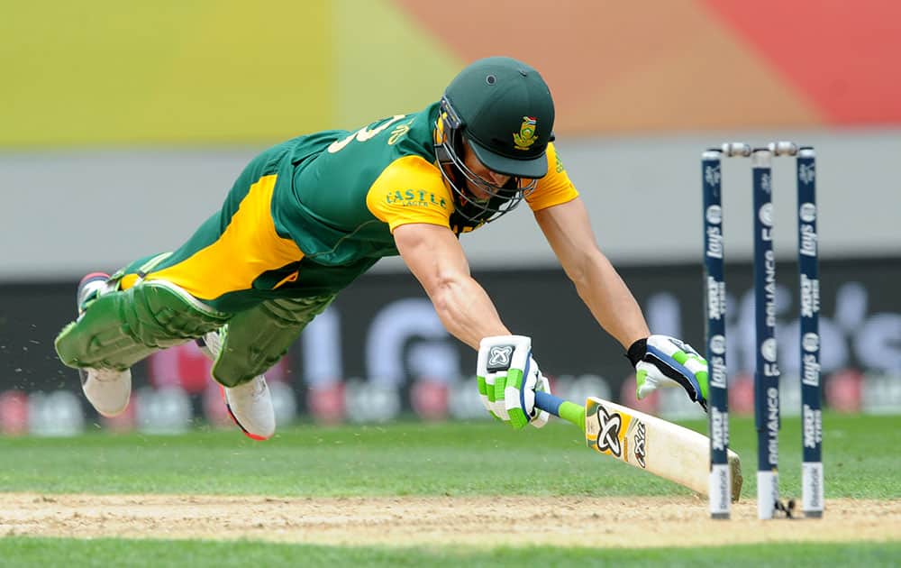 South Africa's Francois Du Plessis dives to make his ground while batting against New Zealand during their Cricket World Cup semifinal in Auckland, New Zealand.