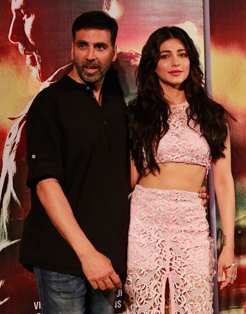 Bollywood actor Akshay Kumar poses with co star Shruti Haasan, right, during the trailer launch of his upcoming movie Gabbar in Mumbai.