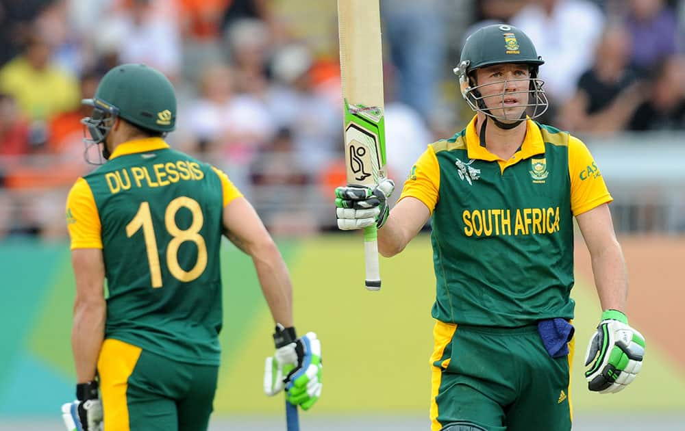 South Africa's AB de Villiers waves his bat after scoring 50 runs while batting against New Zealand during their Cricket World Cup semifinal in Auckland, New Zealand.