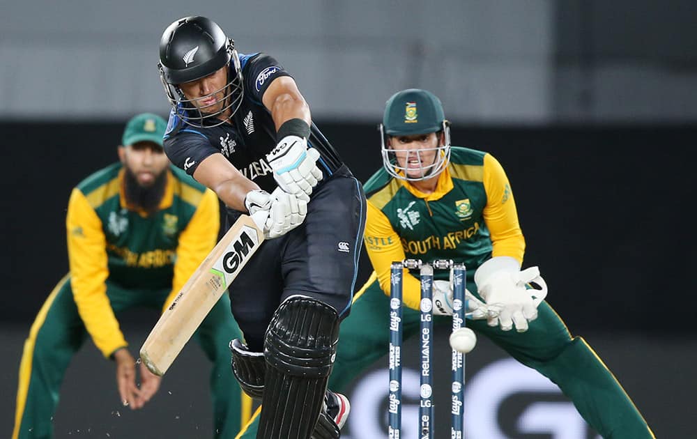 New Zealand’s Ross Taylor plays a shot as South African wicketkeeper Quinton De Kock watches during their Cricket World Cup semifinal in Auckland.