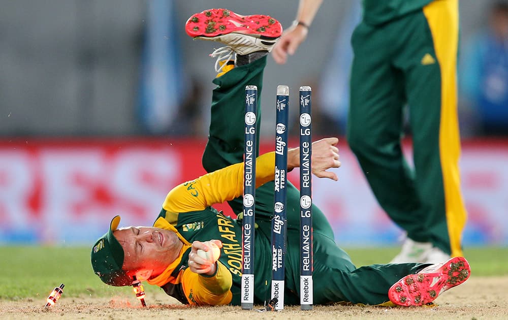 South Africa's AB de Villiers falls over as he attempts a run out during their Cricket World Cup semifinal against New Zealand in Auckland.