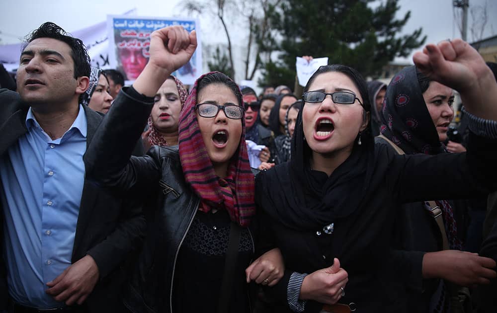 Afghan women chant slogans during a protest demanding justice for a woman who was beaten to death by a mob after being falsely accused of burning a Quran last week, in downtown Kabul, Afghanistan.