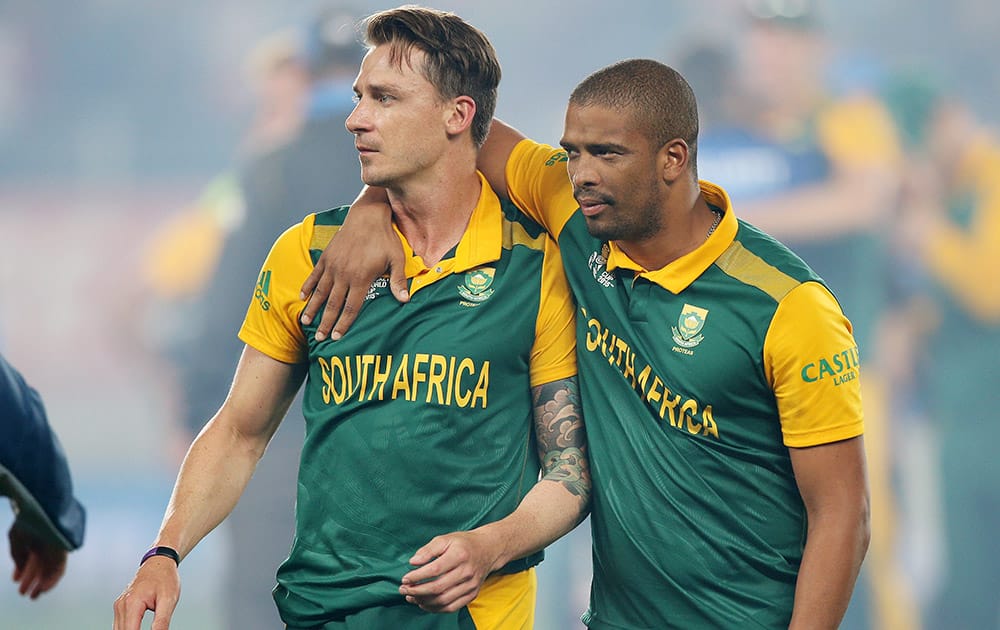 South Africa's Dale Steyn and his teammate Vernon Philander embrace after their four wicket loss to New Zealand in their Cricket World Cup semifinal in Auckland, New Zealand.