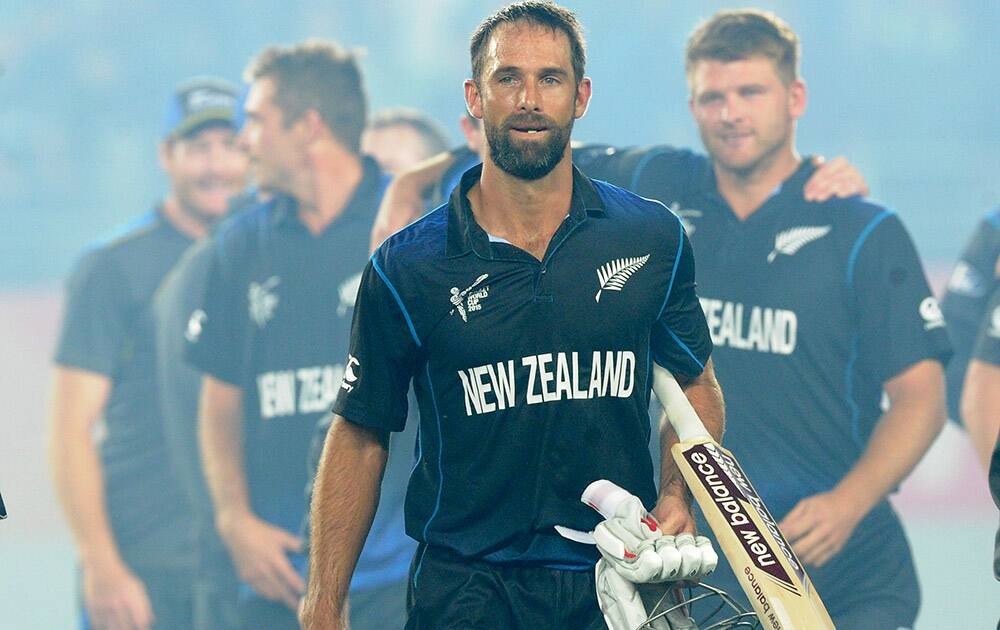 New Zealand’s Grant Elliott walks from the field following his teams four wicket win over South Africa in their Cricket World Cup semifinal in Auckland, New Zealand.