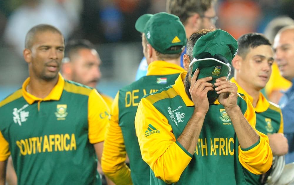 South Africa's Imran Tahir, reacts with his teammates following their four wicket loss to New Zealand in their Cricket World Cup semifinal in Auckland, New Zealand.