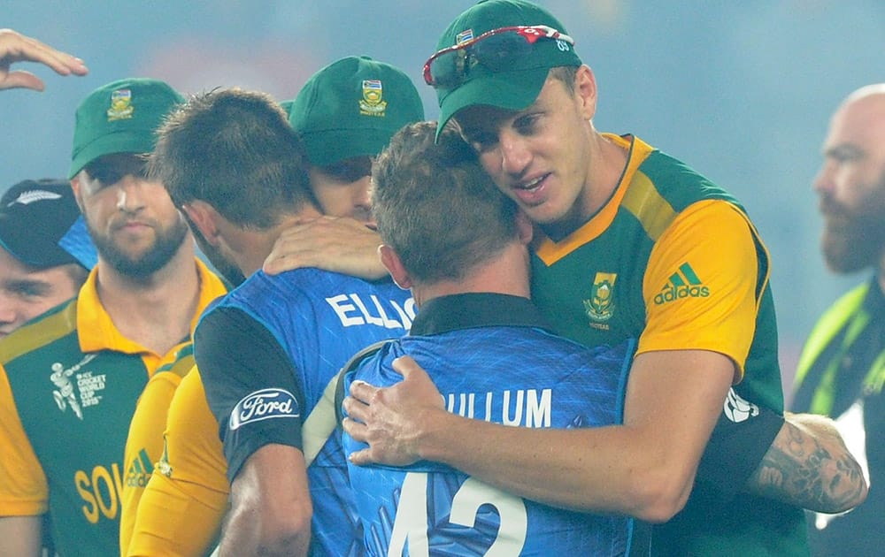 New Zealand’s Brendon McCullum embraces South Africa's Morne Morkel after their Cricket World Cup semifinal in Auckland, New Zealand. New Zealand defeated South Africa by four wickets.