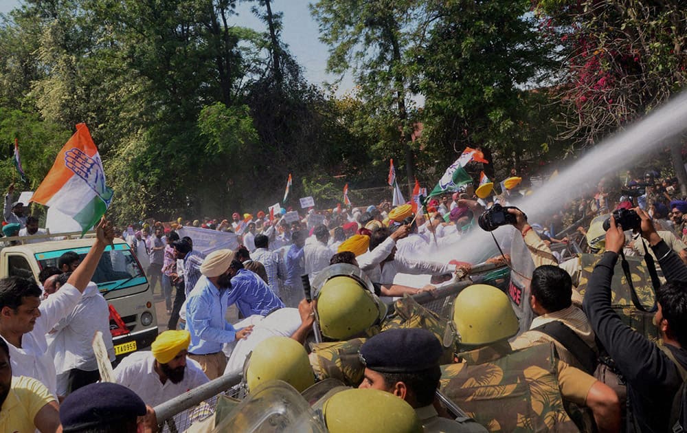 Punjab Congress workers brave the water cannons during a protest in Chandigarh.