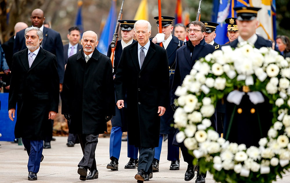 From left, Afghanistan's Chief Executive Officer Abdullah Abdullah, Afghanistan's President Ashraf Ghani, Vice President Joe Bidden, Defense Secretary Ash Carter, and Maj. Gen. Jeffrey Buchanan, commanding general, U.S. Army Military District of Washington, arrive for a wreath laying ceremony at the Tomb of the Unknowns, Tuesday, March 24, 2015, at Arlington National Cemetery in Arlington, Va.