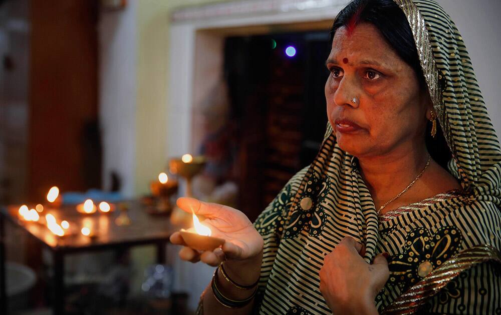 A Hindu devotee prays at a temple in Allahabad. Hindus are observing the nine-day long Navratri festival. 