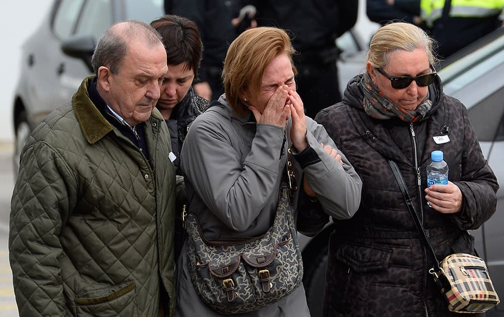 Crying people arrive at Barcelona airport in Spain. A Germanwings passenger jet carrying 150 people crashed Tuesday in the French Alps region as it traveled from Barcelona to Duesseldorf in Germany. 