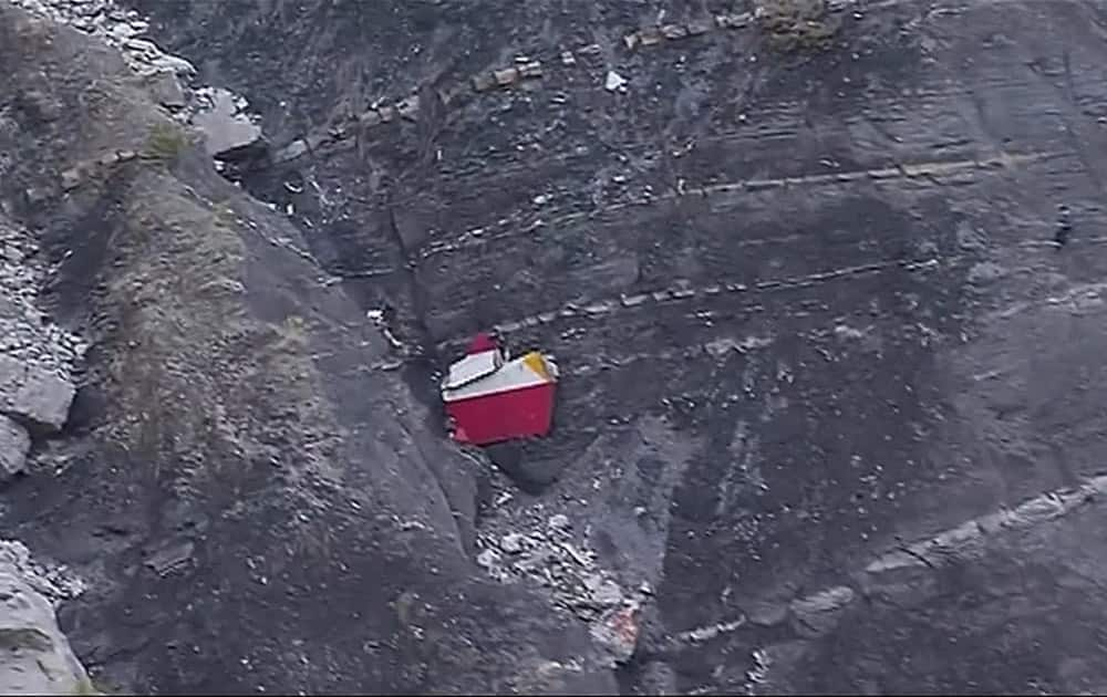 This image made from TV, debris is scattered over the area after a Germanwings Airbus 320 crashed near Seyne-les-Alpes in the French Alps.