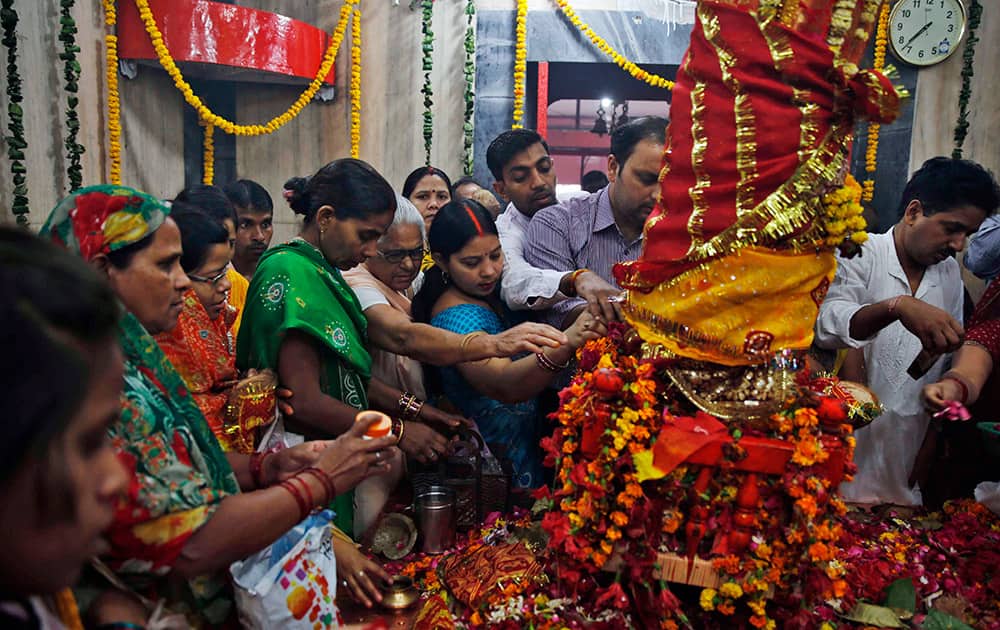 Hindu devotees worship inside Alopi Devi temple during the nine days long 'Navratri' festival, in Allahabad.