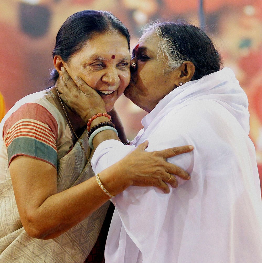 Spiritual leader Mata Amritanandamayi Amma blesses Gujarat Chief Minister Anandiben Patel during a prayer meeting in Ahmedabad.