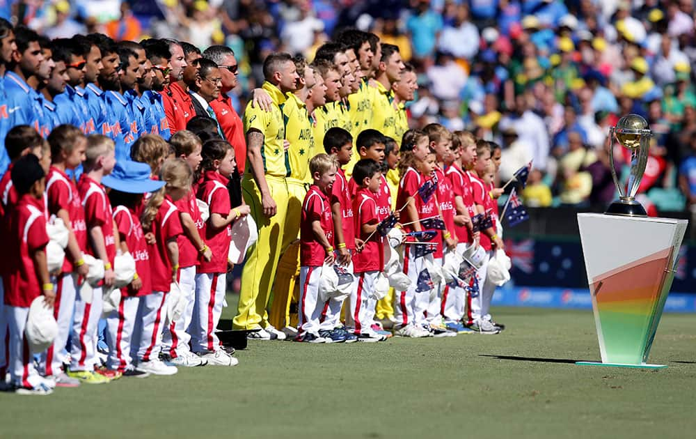 Indian and Australian teams line up for their national anthems ahead of their Cricket World Cup semifinal in Sydney, Australia.