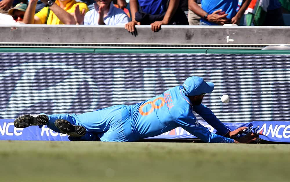 Ravindra Jadeja attempts to stop the ball from crossing the boundary during their Cricket World Cup semifinal against Australia in Sydney