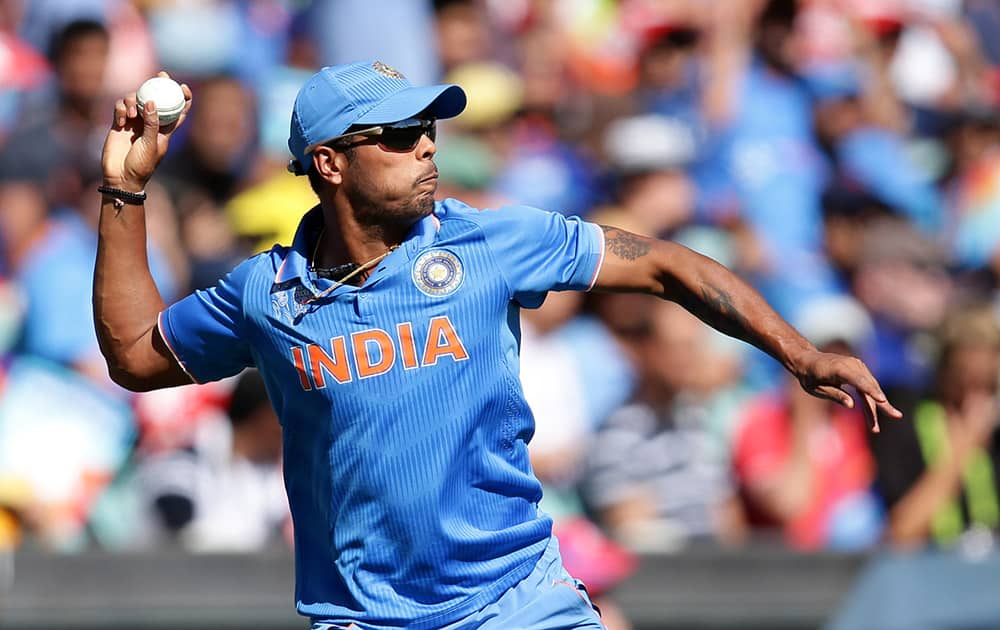 Umesh Yadav throws the ball back to a teammate during their Cricket World Cup semifinal against Australia in Sydney.