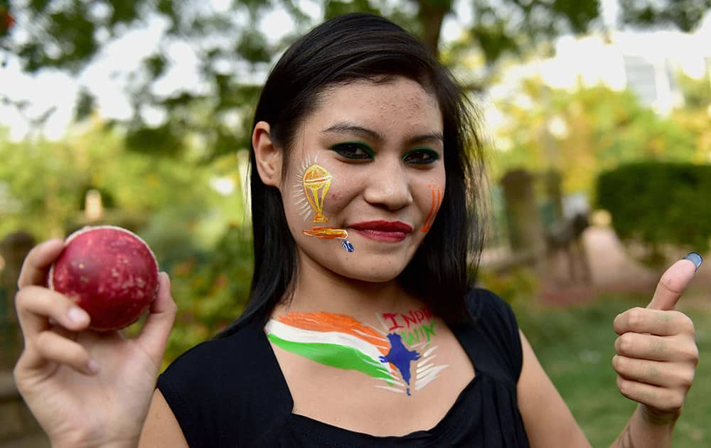 Cricket fan wishes luck to the Indian team ahead of the World Cup semi final clash between India and Australia in Sydney, in Ahmedabad.