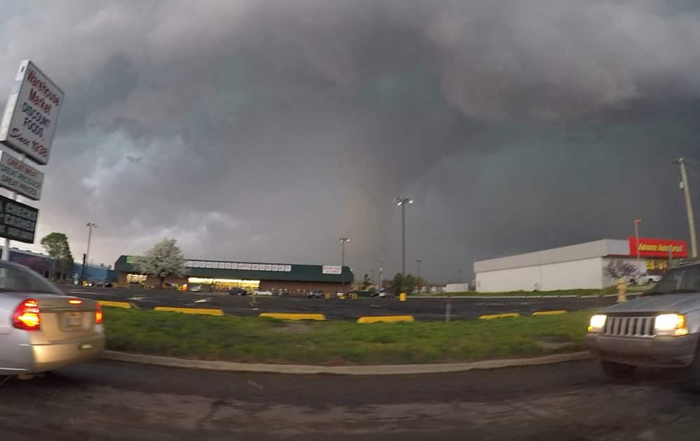 This frame taken from video provided by Brenton Leete shows a funnel cloud in part of a storm, in Sand Springs, Okla. 
