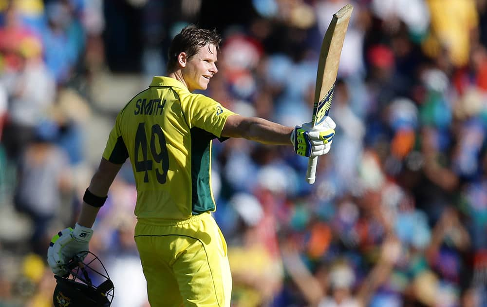 Australia's Steve Smith celebrates after scoring a century while batting against India during their Cricket World Cup semifinal in Sydney, Australia.