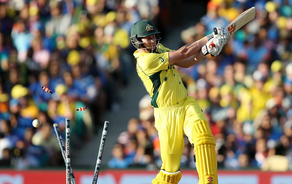 Australia's James Faulkner is bowled out for 21 runs during their Cricket World Cup semifinal against India in Sydney, Australia.