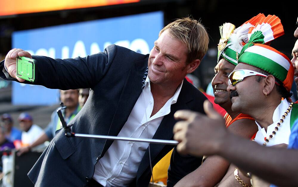 Former Australian cricketer Shane Warne takes a 