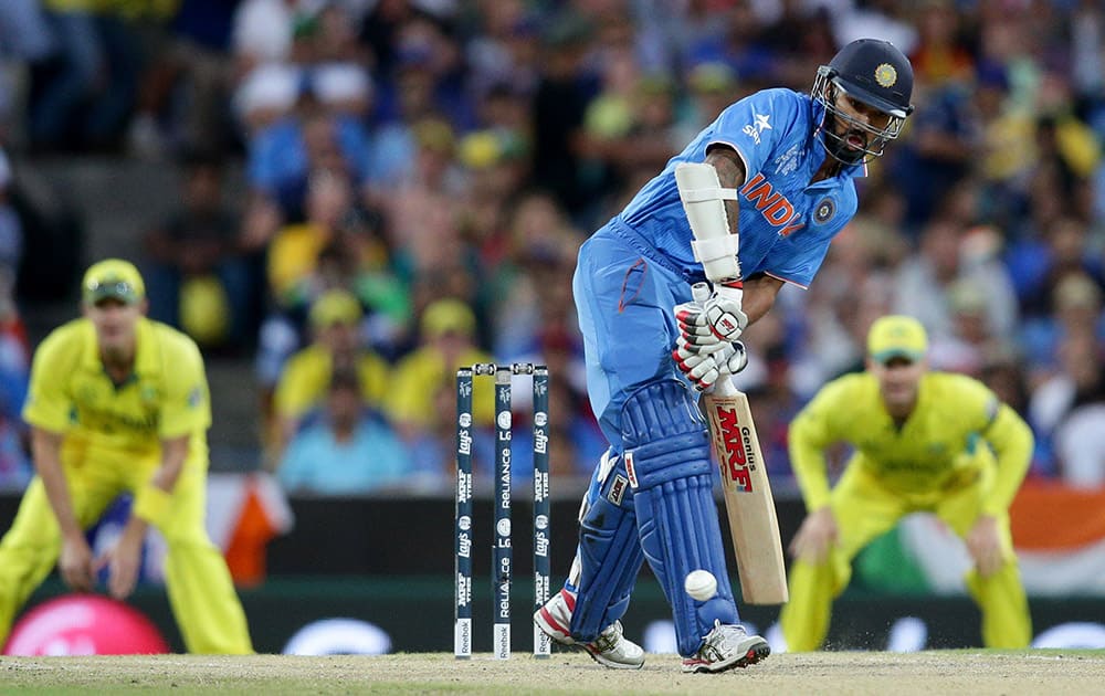 Shikhar Dhawan hits the ball while batting against Australia during their Cricket World Cup semifinal in Sydney.