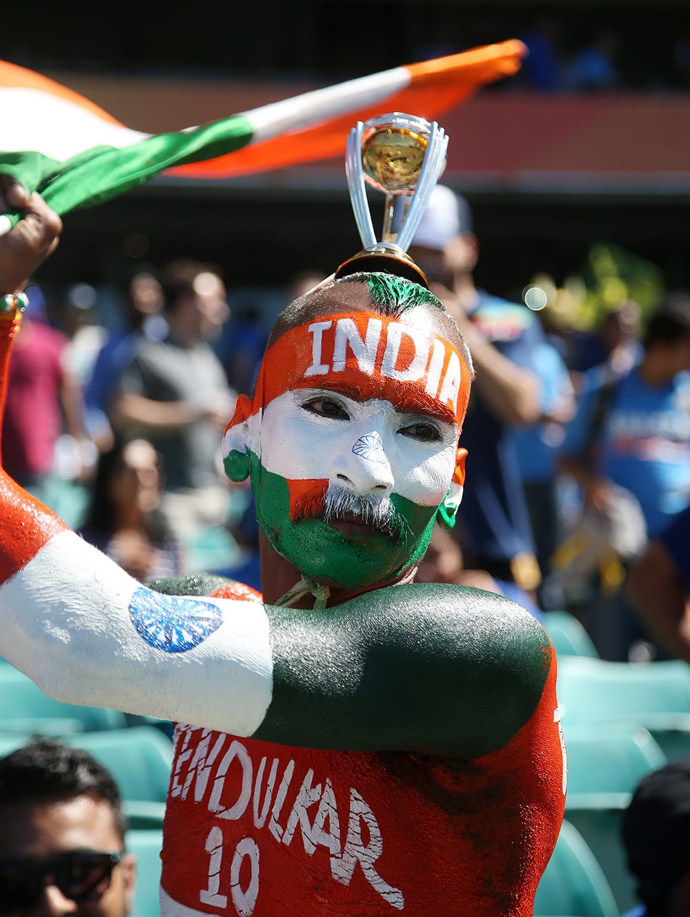 An Indian supporter waves a flag ahead of their Cricket World Cup semifinal against Australia in Sydney, Australia.