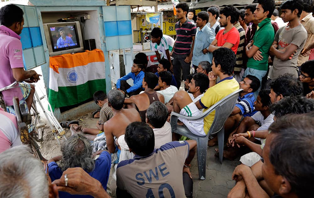 Indian cricket fans gather to watch the ICC Cricket World Cup semifinal match between India and Australia, in Kolkata.