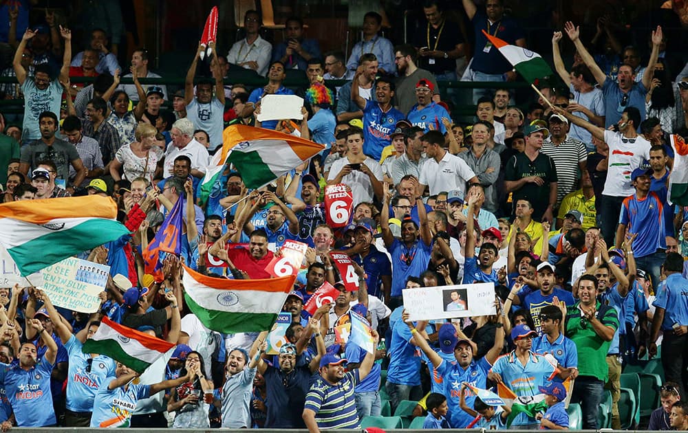 Indian supporters cheer as they watch their team during their Cricket World Cup semifinal against Australia in Sydney, Australia.