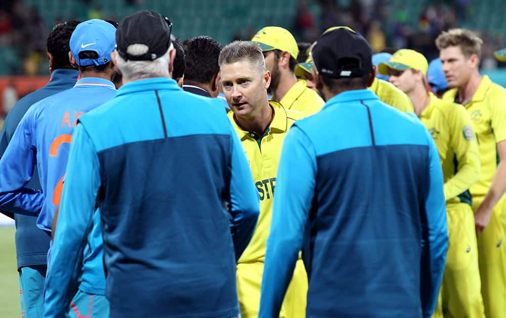 Australian captain Michael Clarke shakes hands with the Indian players after their 95 run win in their Cricket World Cup semifinal in Sydney, Australia.