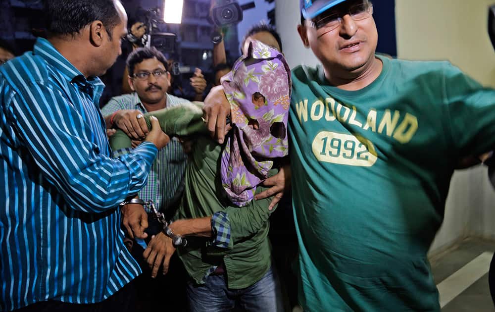 Mohammad Salim Shaikh, one of the two suspects arrested by police in the gang rape of an elderly nun in in a missionary school in eastern India nearly two weeks ago, is brought to the Crime Investigation Department office in Kolkata.