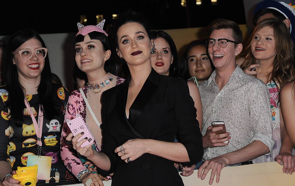 Katy Perry, poses with fans at the World Premiere Of 'Katy Perry: The Prismatic World Tour' held at The Theatre at Ace Hotel, in Los Angeles.