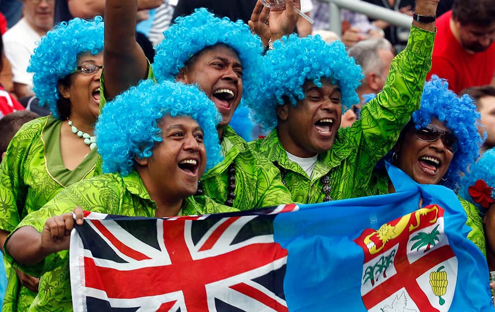 Fiji's rugby fans cheer during the first day of the Hong Kong Sevens rugby tournament in Hong Kong.