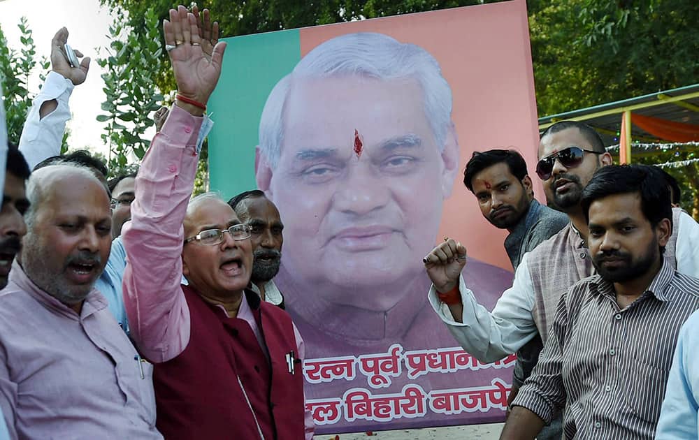 BJP workers celebrate after former Prime Minister Atal Bihari Vajpayee was conferred with Bharat Ratna.